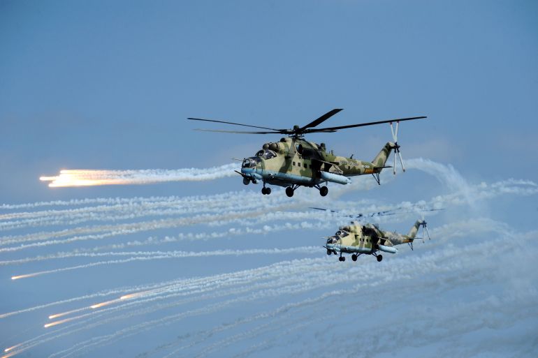 Russian Mi-35 helicopters fire during military exercises in Dagestan