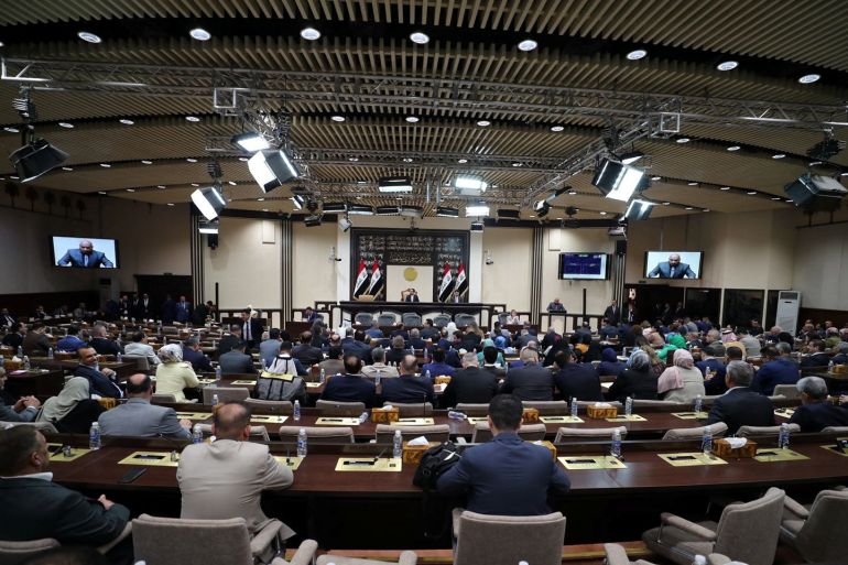 Iraqi lawmakers attend a session of the Iraqi parliament in Baghdad, Iraq, June 23, 2022. Iraqi Parliament Media Office/Handout via REUTERS ATTENTION EDITORS - THIS IMAGE HAS BEEN SUPPLIED BY A THIRD PARTY