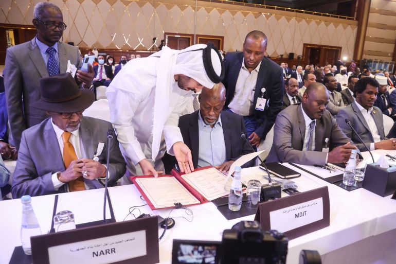 Officials attend a signing agreement for a national dialogue with Chad's transitional military authorities and rebels at Sheraton Hotel in Doha, Qatar August 8, 2022. REUTERS/Ibraheem Al Omari