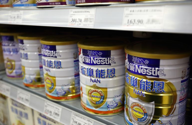 Cans of baby formula manufactured by Nestle SA sit on a shelf inside a supermarket in Beijing, China, on Saturday, March 14, 2015. China is the world's largest dairy importer, accounting for about 30 percent of global purchases, according to Fonterra Cooperative Group Ltd. Photographer: Tomohiro Ohsumi/Bloomberg via Getty Images GettyImages-466949050