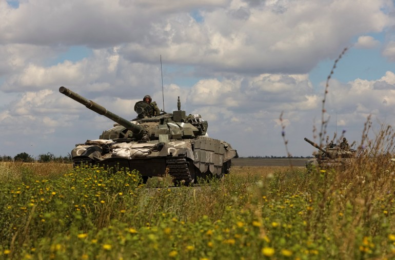 An armoured convoy of Russian troops drives in Ukraine's Zaporizhzhia region