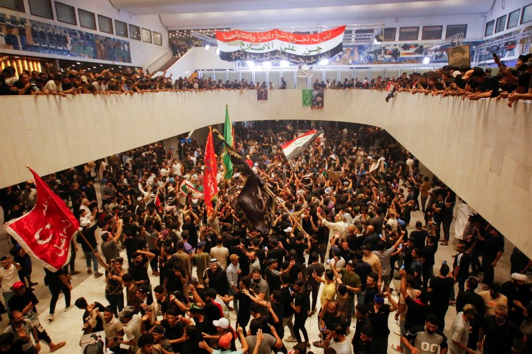 Supporters of Iraqi populist leader Moqtada al-Sadr gather during a sit-in at the parliament building, amid political crises in Baghdad