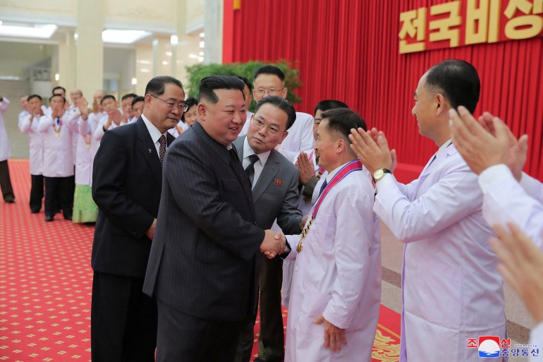 North Korea's leader Kim Jong Un encourages health workers and scientists struggling with the coronavirus disease (COVID-19) pandemic in Pyongyang