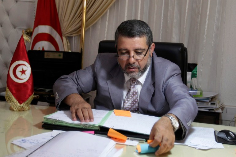 Religious Affairs Minister Khadmi works in his office in Tunis