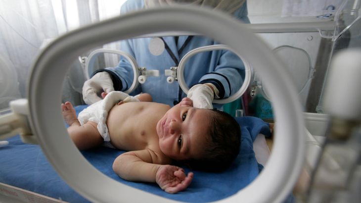 A nurse looks after a premature baby inside an incubator at an Egyptian public hospital in the province of Sharkia to the northeast of Cairo on June 10, 2008. REUTERS/Nasser Nuri (EGYPT)