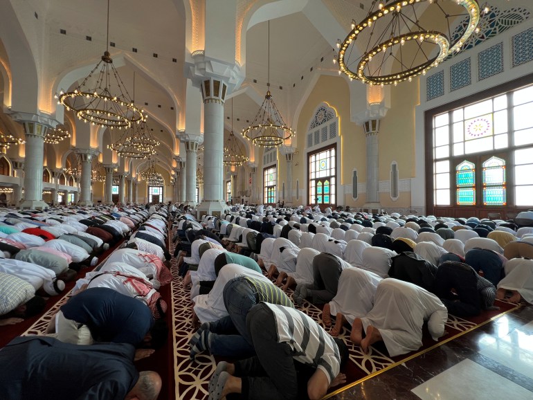 Family members and followers of Islamic scholar, Sheikh Youssef al-Qaradawi, take part in his funeral prayers at the Imam Muhammad bin Abdul Wahhab Mosque, Doha, Qatar, September 27, 2022. REUTERS/Imad Creidi