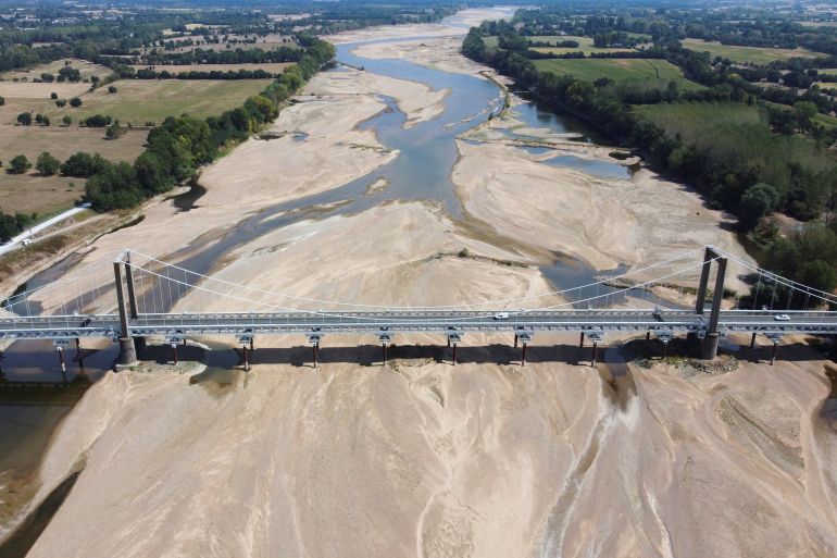 An aerial view shows a branch of the Loire River as historical drought hits France, in Loireauxence, France, August 16, 2022. REUTERS/Stephane Mahe