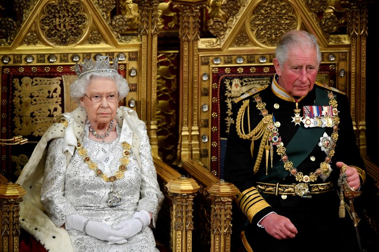 FILE PHOTO: Britain's Queen Elizabeth and Charles، the Prince of Wales are seen ahead the Queen's Speech during the State Opening of Parliament in London، Britain October 14، 2019. REUTERS/Toby Melville/Pool/File Photo