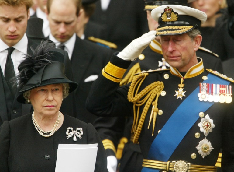 FILE PHOTO: Britain's Royal family, including front row Queen Elizabeth II and her son Prince Charles, and back row Prince William and Prince Edward, show their respect during the funeral for the Queen Mother in London, Britain, April 9, 2002. REUTERS/Dan Chung/File Photo