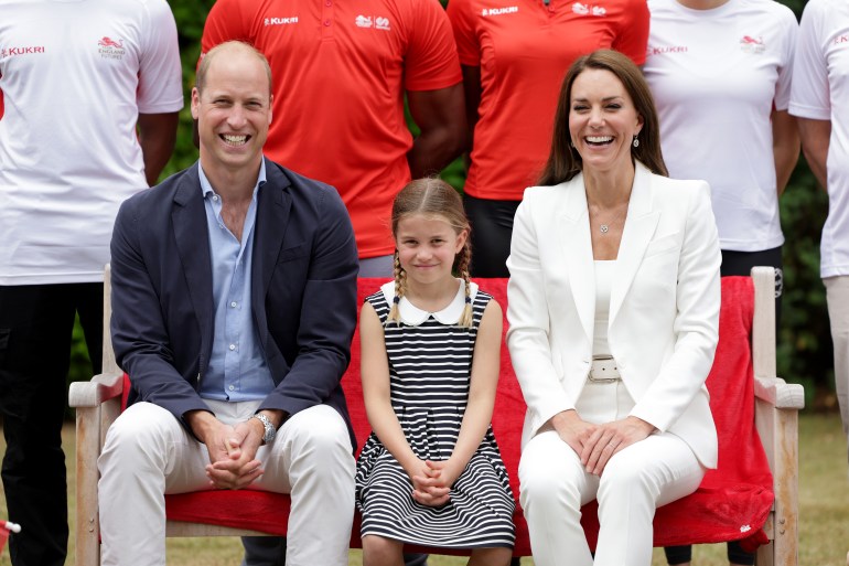 BIRMINGHAM, ENGLAND - AUGUST 02: Prince William, Duke of Cambridge, Catherine, Duchess of Cambridge and Princess Charlotte of Cambridge pose for a photograph as they visit Sportsid House at the 2022 Commonwealth Games on August 02, 2022 in Birmingham, England. The Duchess became the Patron of SportsAid in 2013, Team England Futures programme is a partnership between SportsAid, Sport England and Commonwealth Games England which will see around 1,000 talented young athletes and aspiring support staff given the opportunity to attend the Games and take a first-hand look behind-the-scenes. (Photo by Chris Jackson/Getty Images)