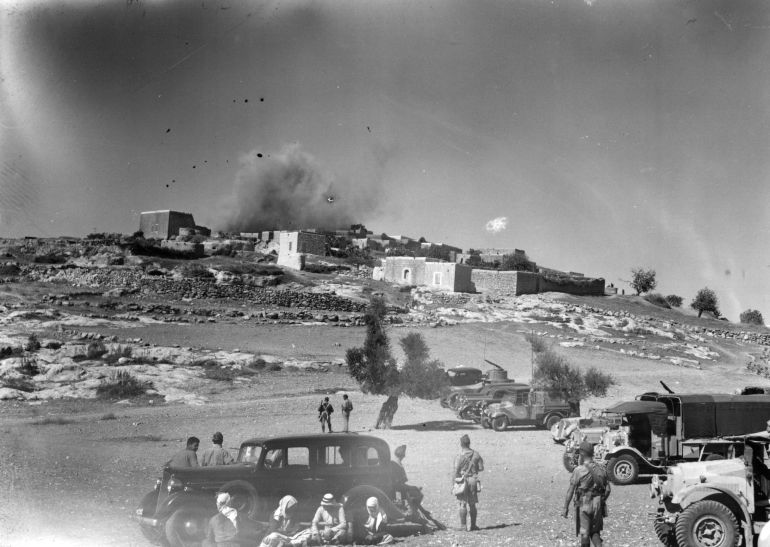 The Arab village of Miar, near Haifa, being blown up during a period of unrest in the British mandate of Palestine. This is a punishment and warning to rebels, by the British. (Photo by Fox Photos/Getty Images)