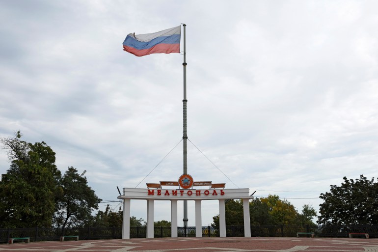 A view shows the Russian flag flying in the square during a five-day referendum on the secession of Zaporizhzhia region from Ukraine and its joining Russia, in the Russian-controlled city of Melitopol in the Zaporizhzhia region, Ukraine September 26, 2022. REUTERS/Alexander Ermochenko
