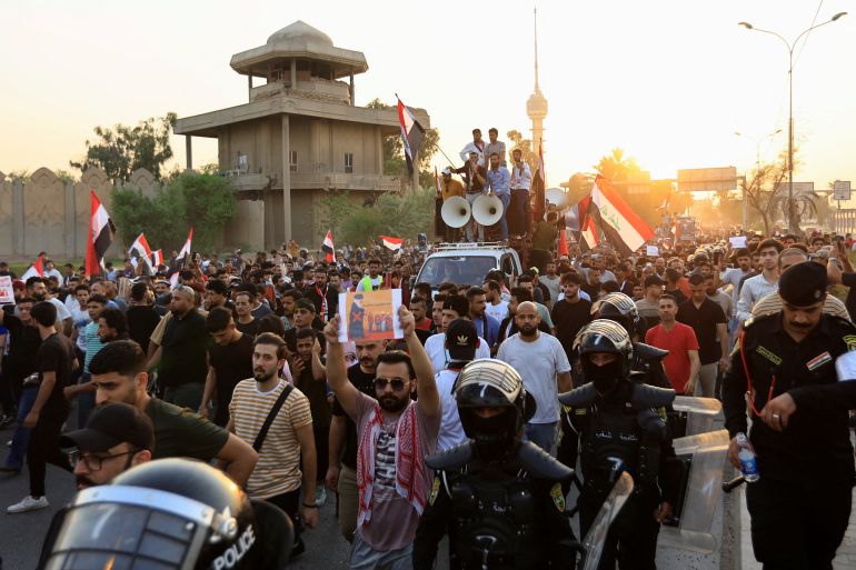 Iraqi demonstrators gather during an anti-government protest in Baghdad