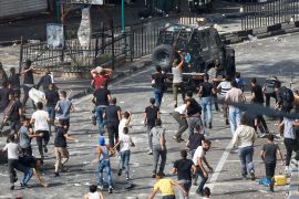 Palestinians protest the arrest of two militants by Palestinian security forces