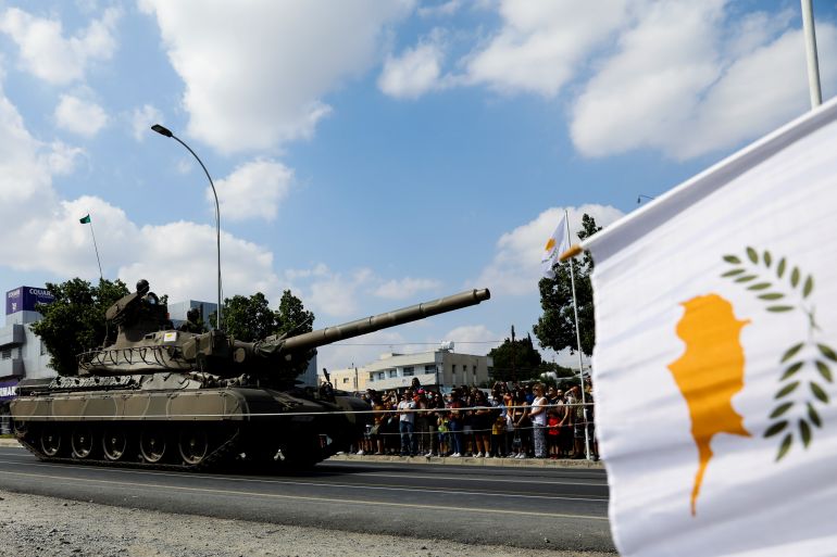 Cypriot army armoured vehicles participate in a military parade marking Cyprus' Independence Day in Nicosia
