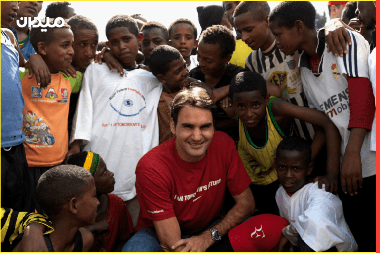 KORE ROBA, ETHIOPIA - FEBRUARY 12: In this handout photo provided by the Roger Federer Foundation, World tennis number one Roger Federer poses with local school children during his visit to a school funded by his charity on February 12, 2010 in Kore Roba, Ethiopia. Federer was on a one-day visit to see the work carried out by the Roger Federer Foundation. Federer founded the foundation in 2003 which currently focuses on helping disadvantaged children in his mother's home country of South Africa. (Photo by Roger Federer Foundation via Getty images)