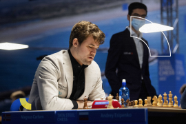 epa09687477 Norwegian chess grandmaster Magnus Carlsen (L) plays during the first round of the Tata Steel Masters chess tournament in Wijk aan Zee, Netherlands, 15 January 2022. EPA-EFE/OLAF KRAAK