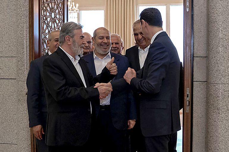 صورة للقاء بين بشار الأسد وممثلي حركات فلسطينية بينهم القيادي في حركة حماس خليل الحية