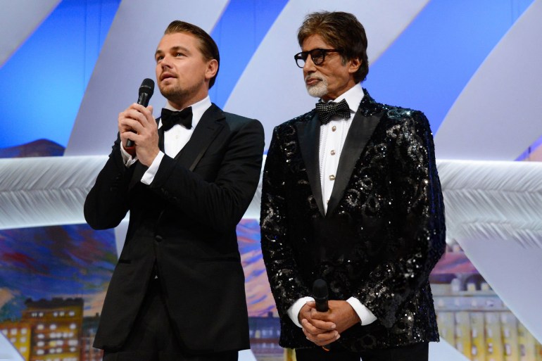 Opening Ceremony Inside - The 66th Annual Cannes Film Festival CANNES, FRANCE - MAY 15: (L-R) Leonardo DiCaprio and Amitabh Bachchan speak during the Opening Ceremony of the 66th Annual Cannes Film Festival at the Palais des Festivals on May 15, 2013 in Cannes, France. (Photo by Pascal Le Segretain/Getty Images) gettyimages-168804596
