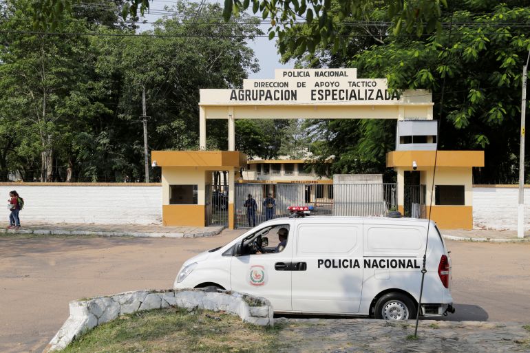 A police van is parked outside the prison where former Brazil's and Barcelona's soccer player Ronaldinho Gaucho is being held with his brother after the two were arrested, in Asuncion