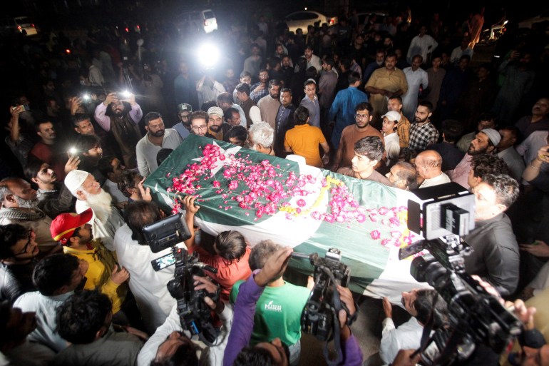 People attend the funeral of Sadaf Naeem, a female journalist who was killed by a vehicle carrying former prime minister Imran Khan in an accident, in Lahore
