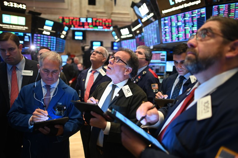 Traders work during the opening bell at the New York Stock Exchange (NYSE) on February 28, 2020 at Wall Street in New York City. JOHANNES EISELE/AFP VIA GETTY IMAGES