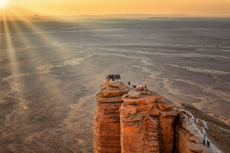 Sun rays on Edge of the World, a natural landmark and popular tourist destination near Riyadh -Saudi Arabia.; Shutterstock ID 1708370740; purchase_order: ajnet; job: ; client: ; other: