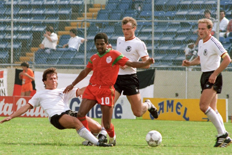 TO GO WITH AFP 2010 WORLD CUP PACKAGE IN ARABIC (FILES) A picture taken on June 17, 1986 shows Moroccan forward Mohammed Timoumi (C) losing the ball after being tackled by West German midfielder Lothar Matthaeus (L) as defender Hans-Peter Briegel (C, background) and forward Karl-Heinz Rummenigge look on, in Monterrey during the 1986 World Cup second round football match between West Germany and Morocco. Matthaeus scored the only goal of the match as West Germany won 1-0. AFP PHOTO/- (Photo by FILES / AFP)