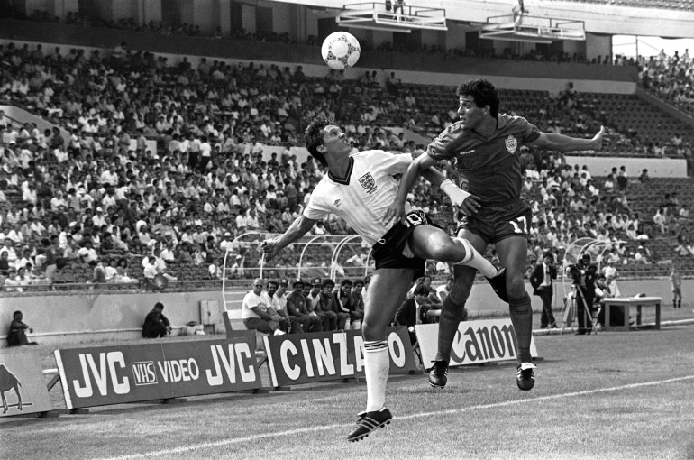 Gary Lineker of England, left, and Moroccos Khairi Abderrazak tussle for the ball, during England Vs Morocco World Cup Group F. football match in Monterrey, Mexico, on June 6, 1986. The game ended in a 0-0 draw. (AP Photo)
