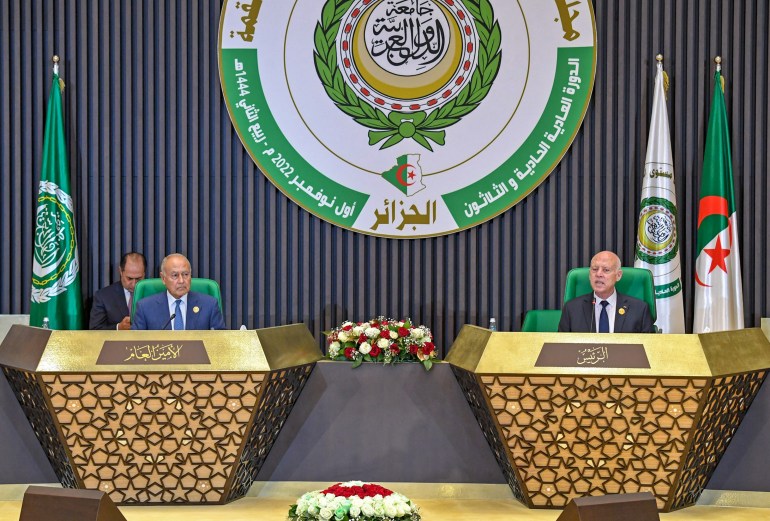 A handout picture provided by the Tunisian presidency press service shows Arab League Secretary-General Ahmed Aboul Gheit (L) and President Kais Saied (R) attending the opening of the Arab summit in Algiers on November 1, 2022. - Arab leaders gathered in the Algerian capital for their first summit since a string of normalisation deals with Israel that have divided the region. (Photo by Tunisian Presidency / AFP) / == RESTRICTED TO EDITORIAL USE - MANDATORY CREDIT "AFP PHOTO / HO / TUNISIAN PRESIDENCY PRESS SERVICE" - NO MARKETING NO ADVERTISING CAMPAIGNS - DISTRIBUTED AS A SERVICE TO CLIENTS ==
