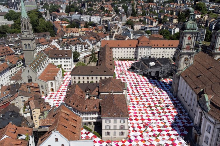 BIGNIK, giant picnic blanket art installation covers streets and square in St. Gallen