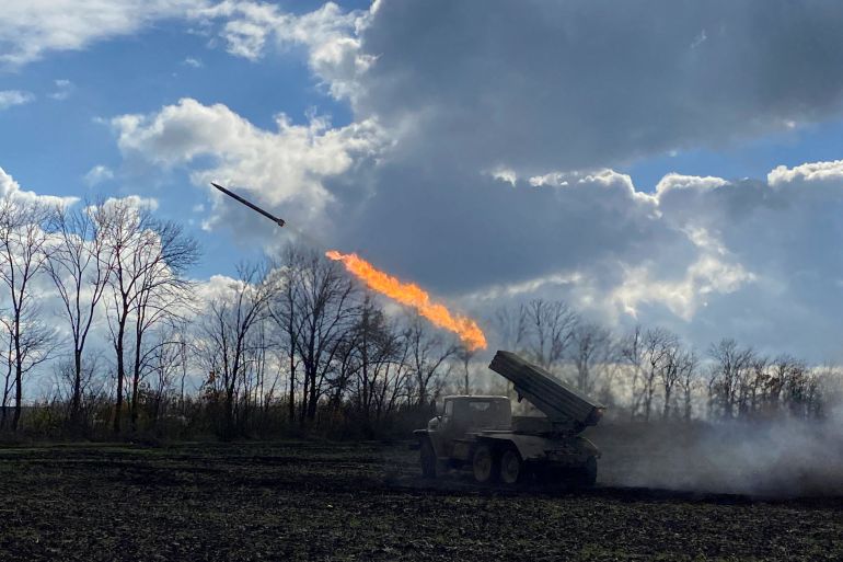 Ukrainian servicemen fire with a BM21 Grad multiple launch rocket system in a frontline on the border of Kharkiv and Luhansk regions