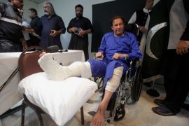 Former Pakistan's Prime Minister Imran Khan sits in a wheelchair after he was wounded following a shooting incident on a long march in Wazirabad, at the Shaukat Khanum Memorial Cancer Hospital & Research Centre in Lahore