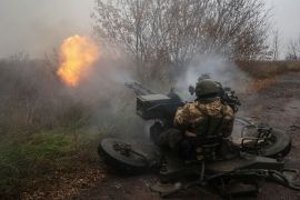 Ukrainian serviceman fires with a ZU-23-2 anti-aircraft cannon at position near a front line in Kharkiv region