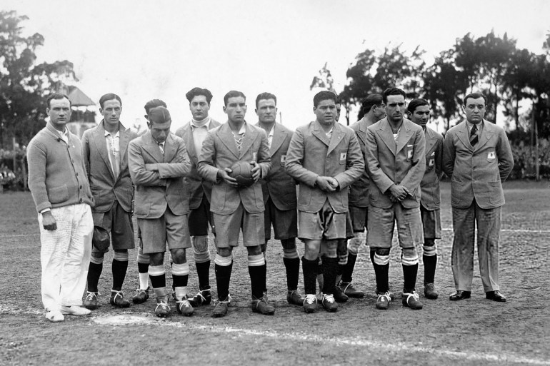 The Argentinan team line up before their first game in the FIFA World Cup Finals, against France at Parque Central in Montevideo, 15th July 1930. Argentina won 1-0. Team captain Manuel Ferreira is holding the ball. (Photo by Bob Thomas/Popperfoto via Getty Images/Getty Images)