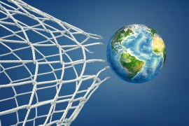 3d rendering of realistic ball colored like an Earth globe flies through a torn football net. International sport. Worldwide competition. Sport for peace. Elements of this image are furnished by NASA (http://visibleearth.nasa.gov/) gettyimages-1070604640