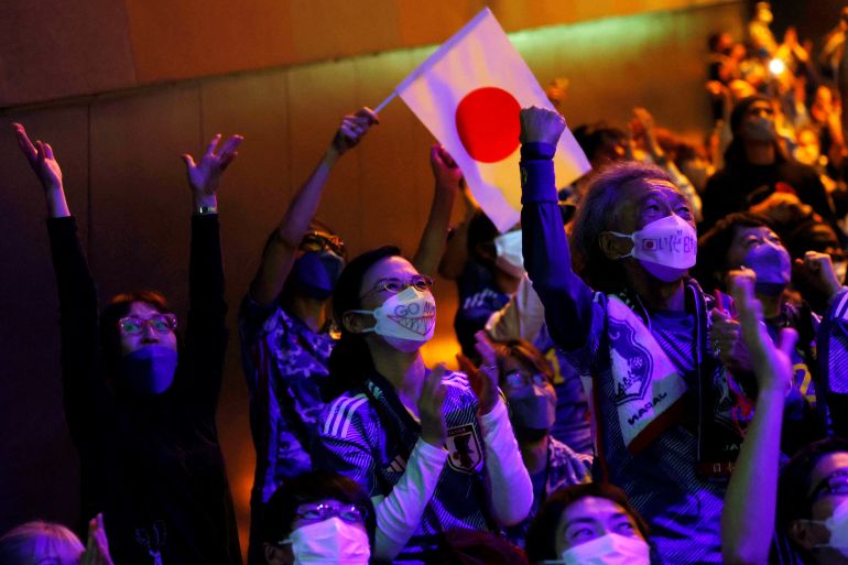 Japa fans react after Japan scored a goal while watching a World Cup Qatar match 2022 between Japan and Germany at a public viewing event to watch the soccer match in Tokyo, Japan November 23, 2022. REUTERS/Kim Kyung-Hoon
