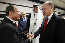 DOHA, QATAR - NOVEMBER 20: Turkish President Recep Tayyip Erdogan shakes hands with President of Egypt Abdel Fattah el-Sisi as they attend reception hosted by Qatari Emir Sheikh Tamim bin Hamad Al Thani on the occasion of the opening ceremony of the 2022 FIFA World Cup in Qatar on November 20, 2022.