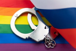 handcuff, Russian flag and flag of LGBT. The problem of the rights of sexual minorities in the country. Concept law banning LGBT propaganda in Russia. non-traditional relations and politics concept.