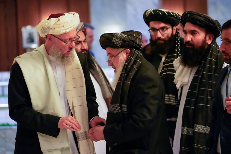 Members of the Taliban delegation, including its head Abdul Salam Hanafi, speak as they take part in international talks on Afghanistan in Moscow, Russia, October 20, 2021. Alexander Zemlianichenko/Pool via REUTERS