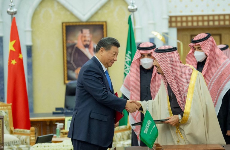 Saudi King Salman bin Abdulaziz shakes hands with Chinese President Xi Jinping in Riyadh, Saudi Arabia December 8, 2022. Saudi Press Agency/Handout via REUTERS ATTENTION EDITORS - THIS PICTURE WAS PROVIDED BY A THIRD PARTY