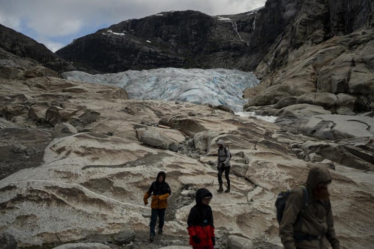 As climate clock ticks, aviator races to photograph glaciers