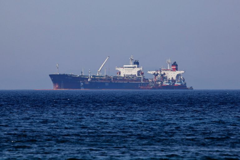 The Liberian-flagged oil tanker Ice Energy transfers crude oil from the Iranian-flagged oil tanker Lana off the shore of Karystos