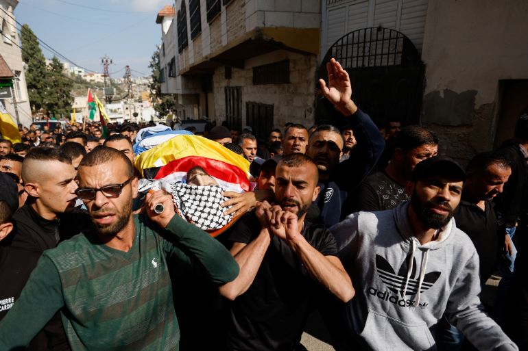 Mourners attend the funeral of Palestinian Raafat Issa, in Jenin