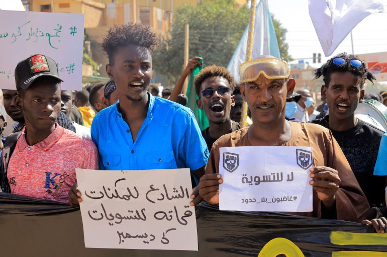 Protesters march during a rally against signed a framework deal in Khartoum