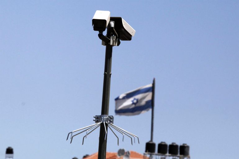 A Surveillance camera is seen at the Mount of Olives with an Israeli flag in the background on May 16, 2012 in Jerusalem, Israel. gettyimages-1349953768