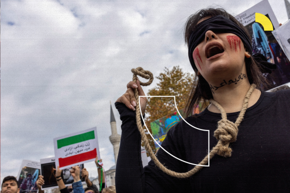 A member of the Iranian community living in Turkey holds a rope as letters on her neck reads, "#no to death penalty" during a protest in support of Iranian women, after the death of Mahsa Amini, in Istanbul, Turkey November 19, 2022. REUTERS/Umit Bektas