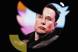 Elon Musk's photo is seen through a Twitter logo in this illustration taken October 28, 2022. REUTERS/Dado Ruvic/Illustration