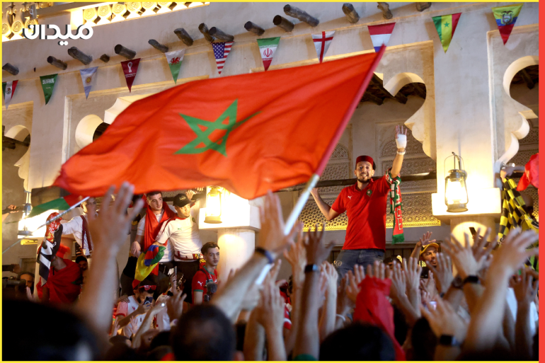 DOHA, QATAR - DECEMBER 01: Morocco fans celebrate in Souq Waqif after getting through to the Round of 16 during the FIFA World Cup Qatar 2022 at on December 01, 2022 in Doha, Qatar. (Photo by Christopher Lee/Getty Images)