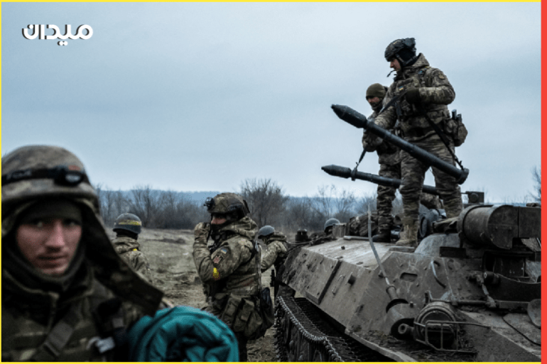 Servicemen of the Carpathian Sich Battalion are seen near an Armoured Personnel Carrier (APC) on a frontline, as Russia's attack on Ukraine continues, near the town of Lyman, Donetsk region, Ukraine December 8, 2022. REUTERS/Viacheslav Ratynskyi TPX IMAGES OF THE DAY